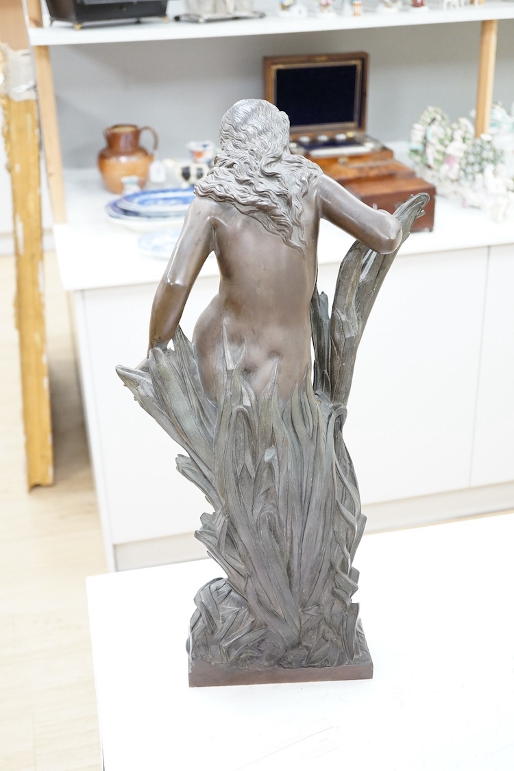 Joseph Auguste Carrier, a bronze figure of a nude maiden, c.1900, standing amid bull rushes signed at base, 56cm high. Condition - rubbed in places